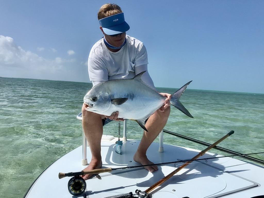 A man fly fishing for permit on a flats fishing charrter.