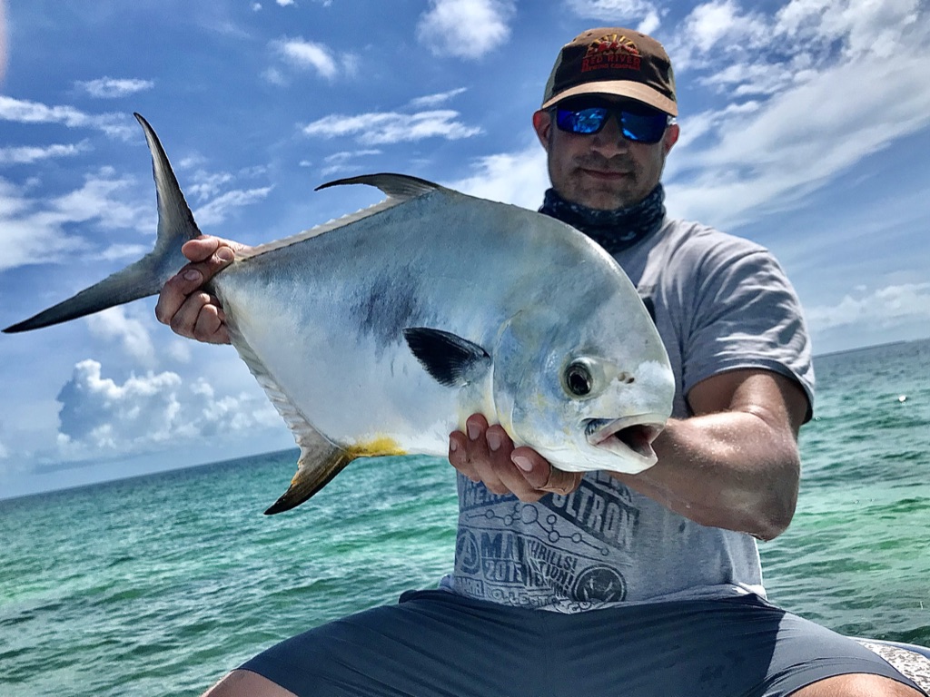 A nice permit caught during a perfect weather fishing day.