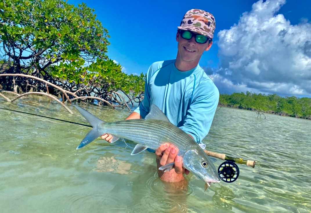 An angler flyfishing for bonefish
