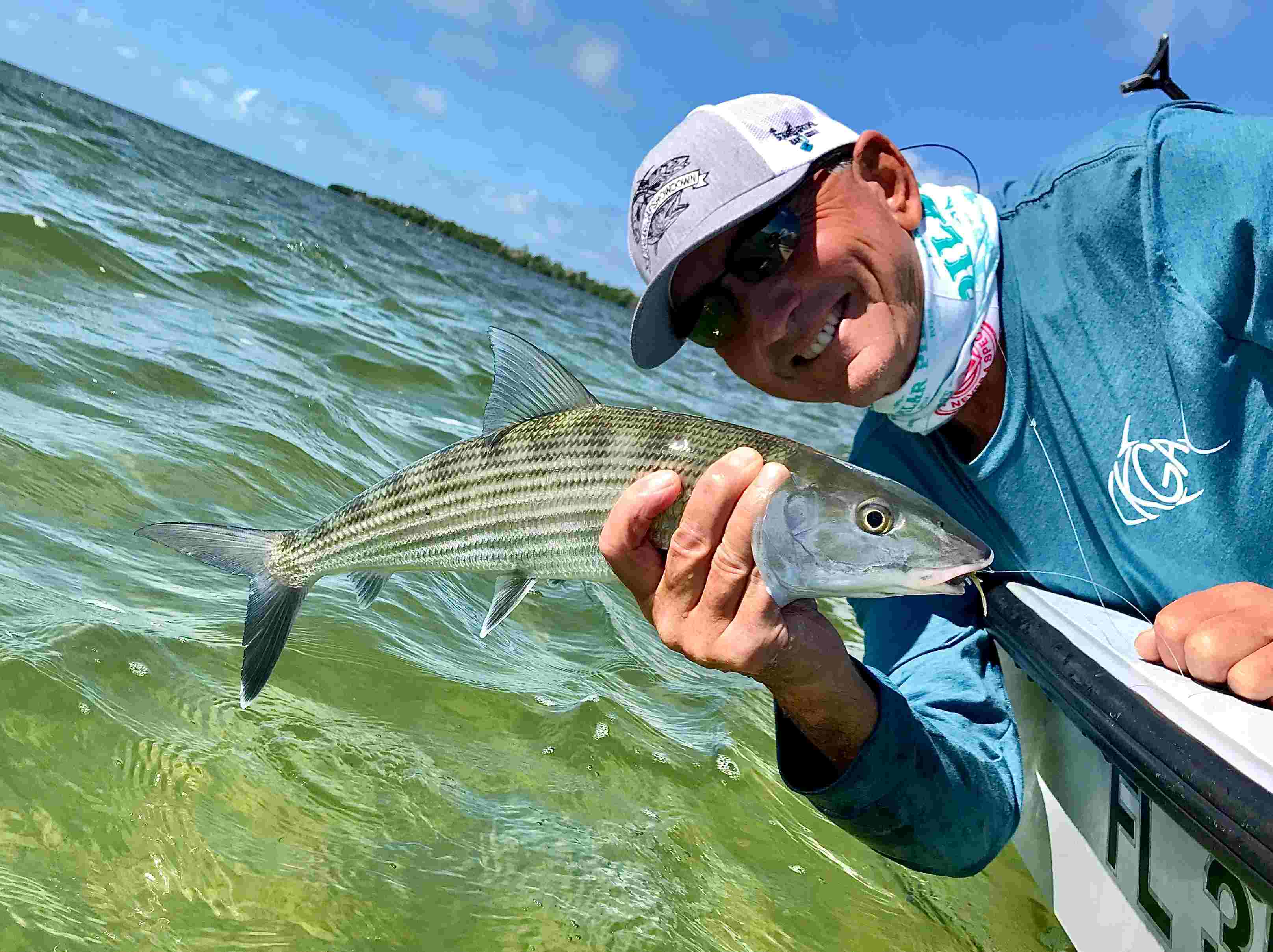 An angler fishing for bonefish during Florida Keys summer months